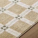 Close up of the Kalkin Tan Area Rug showing its tan and white plaid pattern and textured weave. Texture