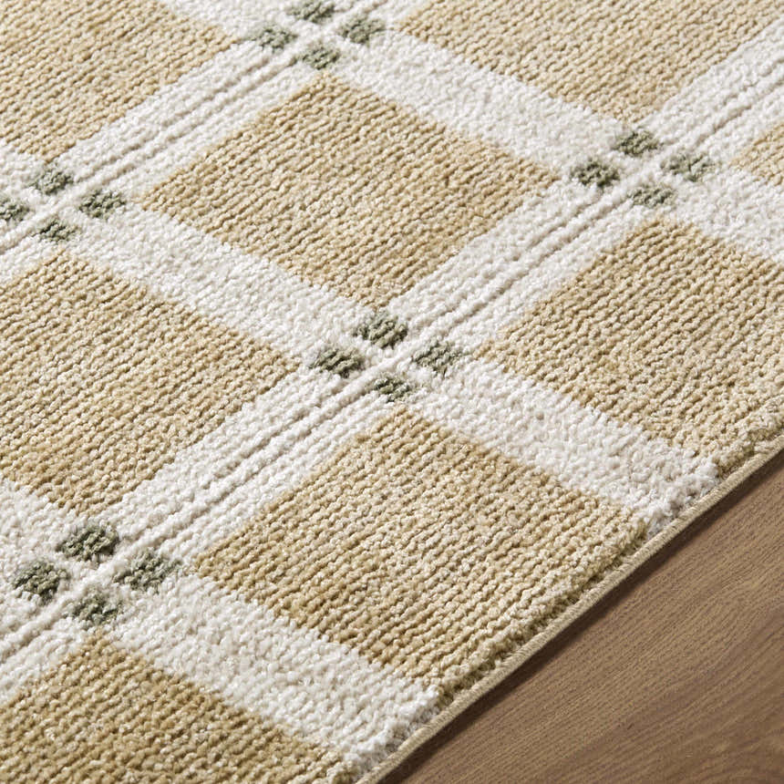 Close up of the Kalkin Tan Area Rug showing its tan and white plaid pattern and textured weave. Texture