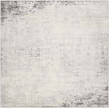 Close-up of the Kalanganan Abstract Gray Rug. Charcoal, gray, and off-white tones create a contemporary, textured design. Design-Square-710