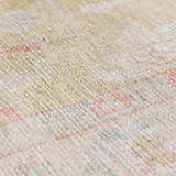 Close-up of the Bozkurt Boutique Washable Rug, showing its woven texture and cloud gray, lambswool, and pink tones. Texture