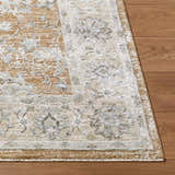 Close-up of the Kerem Damask Thick Luxe Boutique Rug showing its cream, light brown, and light gray traditional pattern. Front