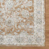 Close-up of the Kerem Damask Thick Luxe Boutique Rug. Features a traditional floral pattern in charcoal, cream, and light brown. Corner
