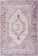 Close-up of the Wayde Area Rug. Hand-tufted polyester rug in dusty rose, lavender, and mauve with a traditional, farmhouse design. Design-Rectangle-576