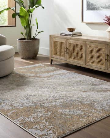 Living room scene with a cream and gray Akuchi Area Rug, light wood media console, and neutral armchair. Roomscene-Rectangle