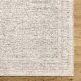 Close-up of Livabliss x Galey Alix Maria Elena V Vintage Medallion Area Rug showing ivory, tan, and brown tones. Corner