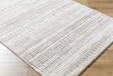 Close-up of the Akande Shag Area Rug, ash, light silver, and silver gray shag rug with a subtle geometric pattern. Corner