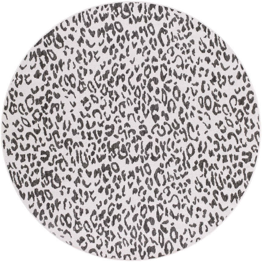 Close-up of a round Alderbury White Leopard Print Rug. Black and charcoal animal print on off-white polypropylene. Design-Round-53