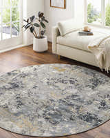 Bright living room with round Lenzburg Faux Silk Abstract Rug in charcoal, gray, and mustard tones. Roomscene-Round