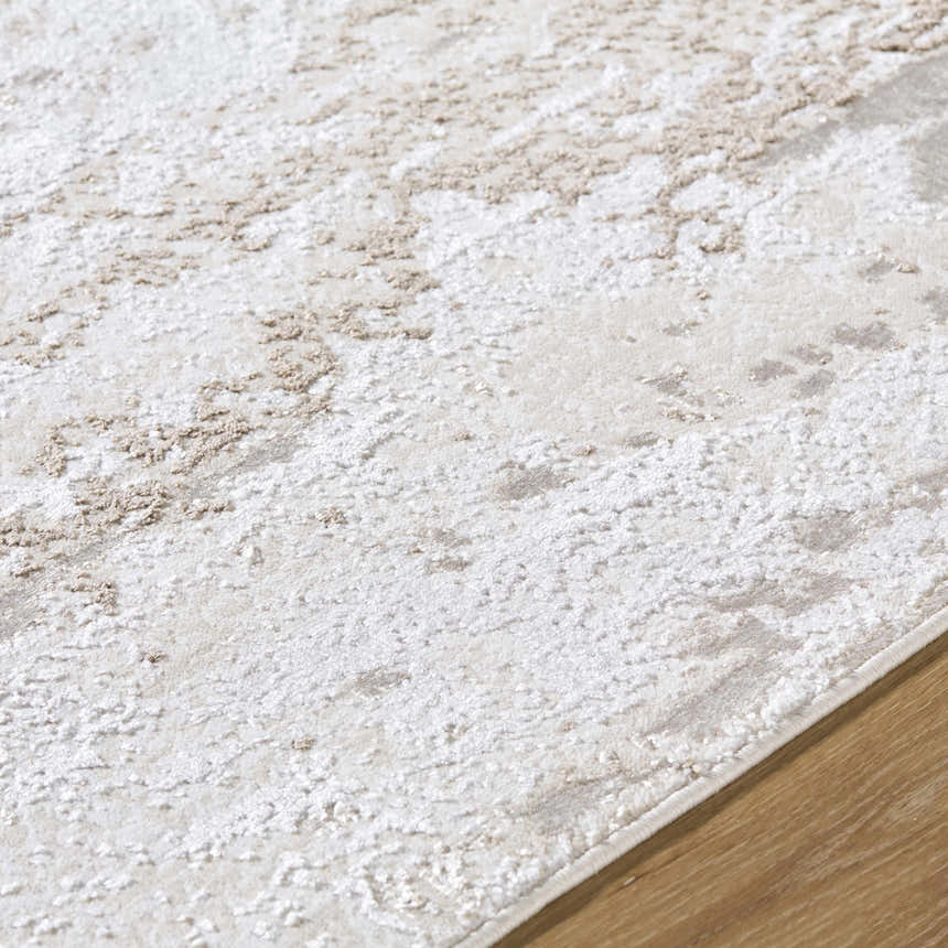 Close-up of the Arenda Tan Area Rug, showing cream and tan abstract pattern and soft texture. Texture