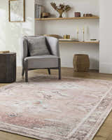Living room scene with a gray chair on a beige and rust Ussun Washable Area Rug. Roomscene-Rectangle