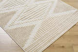 Close-up of the Annika Light Brown 3D Washable Area Rug. Features a geometric pattern with raised, textured beige lines. Corner