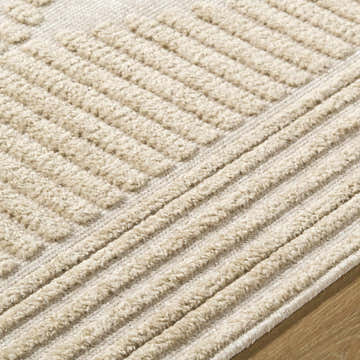 Close up of the Annika Light Brown 3D Washable Area Rug showing beige textured geometric and striped pattern. Texture