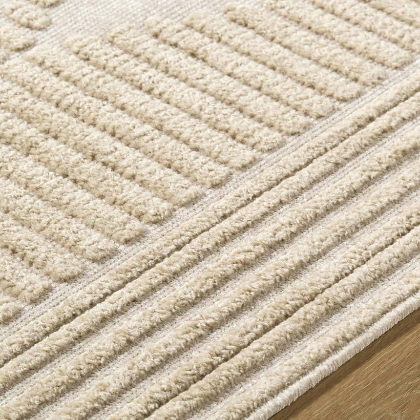 Close up of the Annika Light Brown 3D Washable Area Rug showing beige textured geometric and striped pattern. Texture