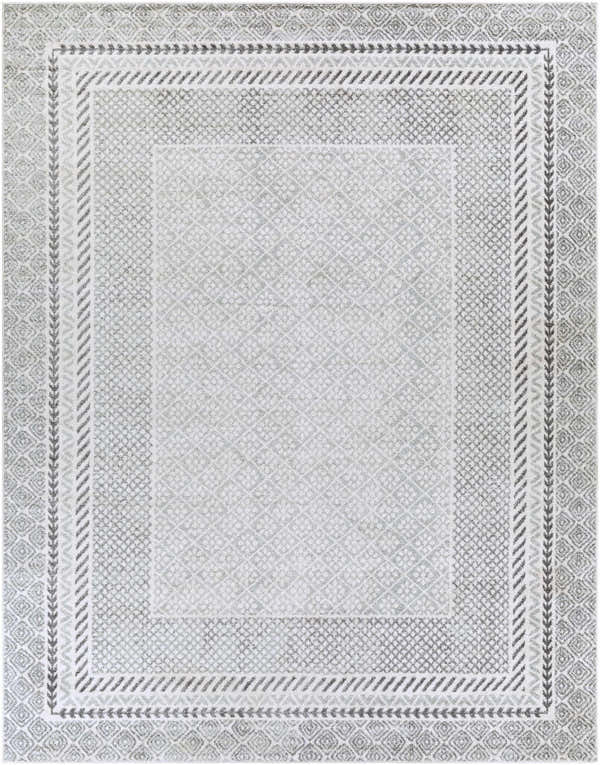 Close-up of the Lovern Area Rug. Farmhouse style rug in charcoal, gray, ivory, and light slate with geometric patterns. Design-Rectangle-710103