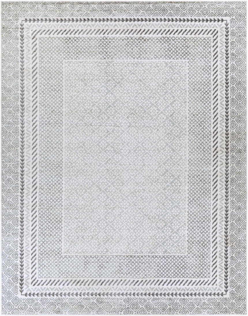 Close-up of the Lovern Area Rug. Farmhouse style rug in charcoal, gray, ivory, and light slate with geometric patterns. Design-Rectangle-710103