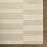 Close-up of the hand-tufted Argyro Area Rug. Beige and ivory wool rug with a striped, transitional design on hardwood floors. Swatch