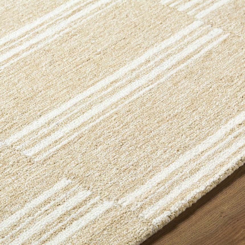 Close-up of the Argyro Area Rug, a hand-tufted wool rug with beige and ivory stripes. Farmhouse style. Texture