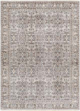 Detailed view of the Lugo Luxe Area Rug, a traditional rug with a charcoal and light gray floral pattern and tassel detail. Design-Rectangle-537