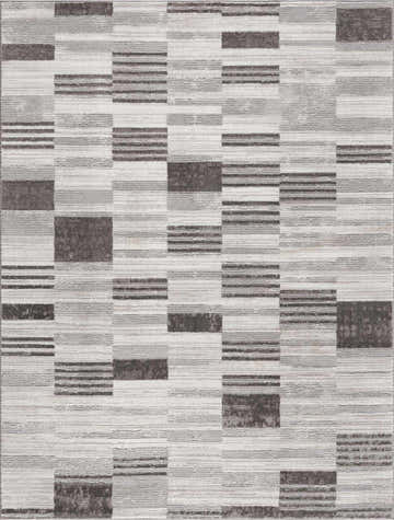 Close-up of the Bronka Broken-Striped Area Rug. Geometric design in black, gray, and off-white. Machine woven texture. Design-Rectangle-5373