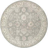 Close-up of the round Alinae Area Rug. Features a traditional floral pattern in cream, green, and light slate blue. Design-Round-53