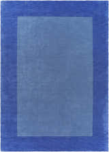 Close-up of a Macedon Blue Bordered Wool Rug, featuring a solid light blue center and a dark blue border. Design-Rectangle-811