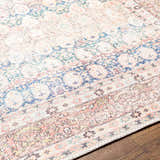 Close-up of the Maligaya Distressed Washable Rug with bone, gray, and nutmeg tones on hardwood floor. Persian style. Texture