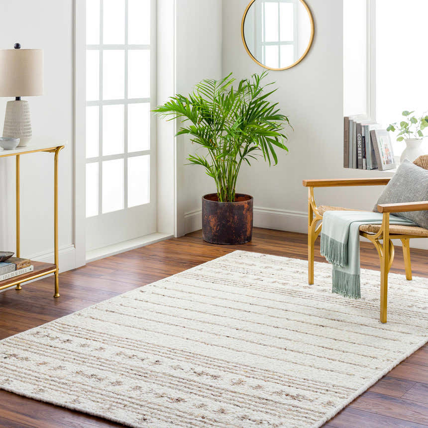 Living room scene with a cream and taupe striped Matawan Premium Wool Rug. Roomscene-Rectangle