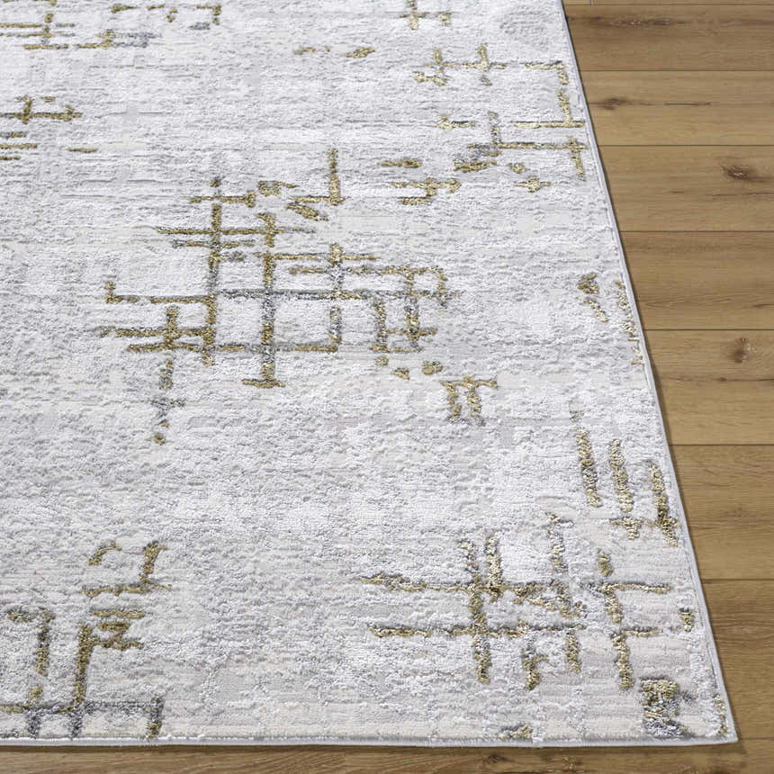 Close-up of Auriel Gray Area Rug. Contemporary design with charcoal, cream, and olive geometric pattern and soft texture. Front