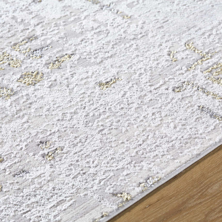 Close-up of the Auriel Gray Area Rug showing its contemporary charcoal, cream, and olive abstract pattern and soft texture. Texture
