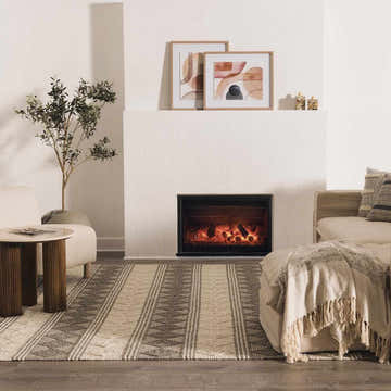 Living room scene with a charcoal and white Mineola Wool Area Rug, fireplace, and neutral furniture. Roomscene-Rectangle