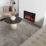Living room scene with a beige sofa, fireplace, and the beige and gray Minoa Area Rug. Roomscene-Rectangle