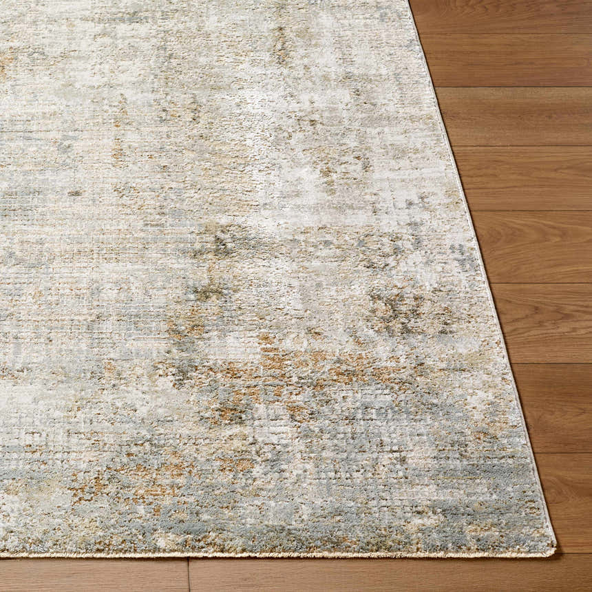 Close up of the Marli Thick Luxe Area Rug showing charcoal, cream, and brown tones on wood floors. Front