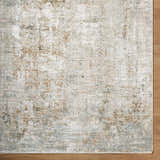 Close-up of the Marli Thick Luxe Area Rug. Abstract design with charcoal, cream, light brown, and light gray tones. Corner