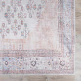 Close-up of the Moora Washable Area Rug; oriental design in aqua, blush, and brown tones. Machine-woven texture. Swatch