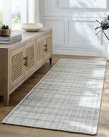 Entryway with a Nissa Blue Gray Checkered Area Rug, light wood floors, and a console table. Roomscene-Runner