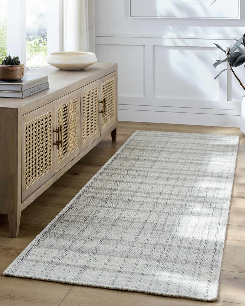Entryway with a Nissa Blue Gray Checkered Area Rug, light wood floors, and a console table. Roomscene-Runner