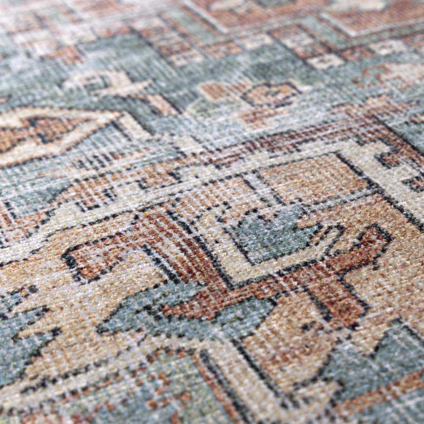Close-up of the Green Nisa Tumble Dry Washable Rug, showcasing its seafoam, tan, and brick red Persian-style pattern and texture. Texture