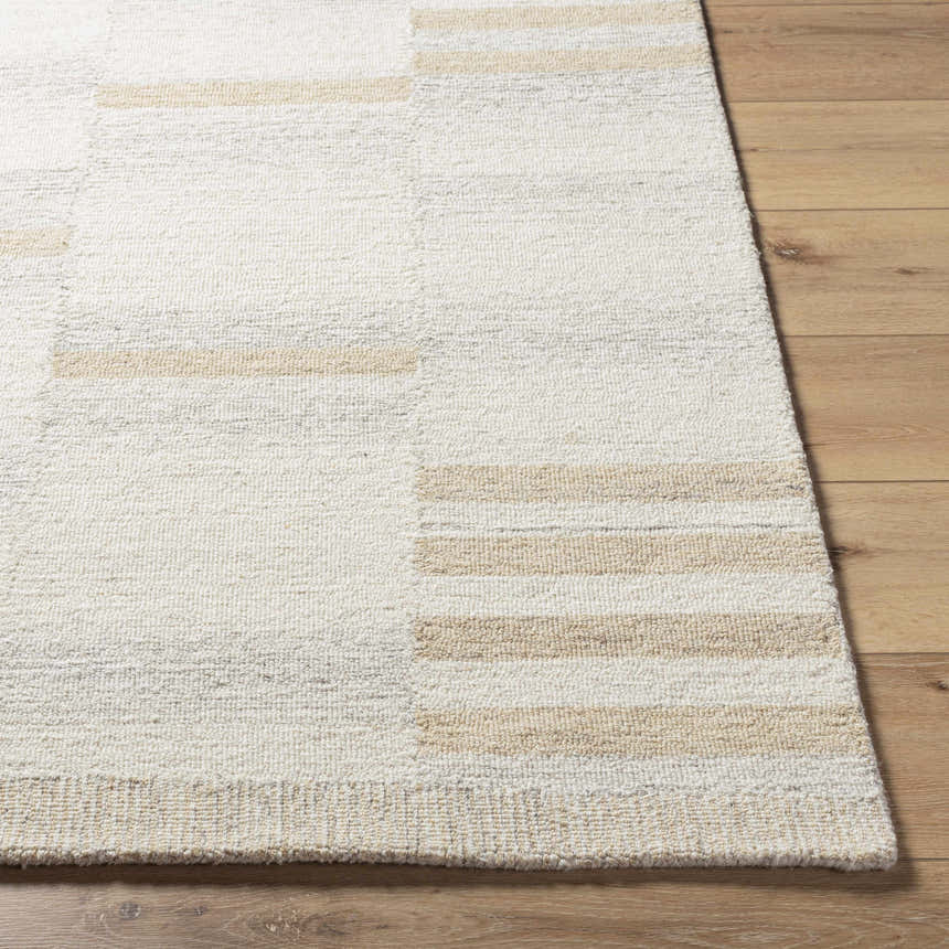 Close-up of the hand-tufted Max Handmade Becki Owens x LIVABLISS BOMX-2300 Area Rug. Cream and tan wool texture. Front
