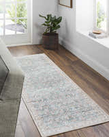 Entryway with Ayanna Washable Area Rug. Runner rug in cream, teal, and red with traditional pattern on wood floor. Roomscene-Runner