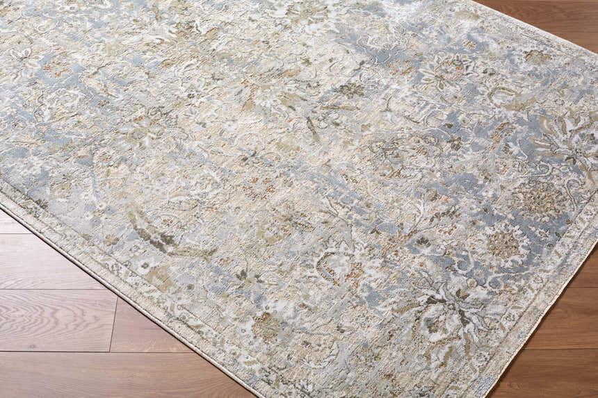 Close-up of the Nasir Thick Luxe Boutique Rug, showcasing its traditional charcoal, cream, and light brown floral pattern. Corner