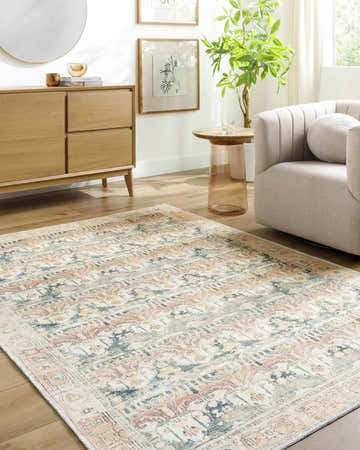 Living room scene with Akello Washable Area Rug in camel, cream, rust, and green. Farmhouse style with wood furniture. Roomscene-Rectangle