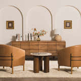 Living room scene with a cream Oakridge Area Rug, tan leather chairs, and a wood cabinet. Roomscene-Rectangle