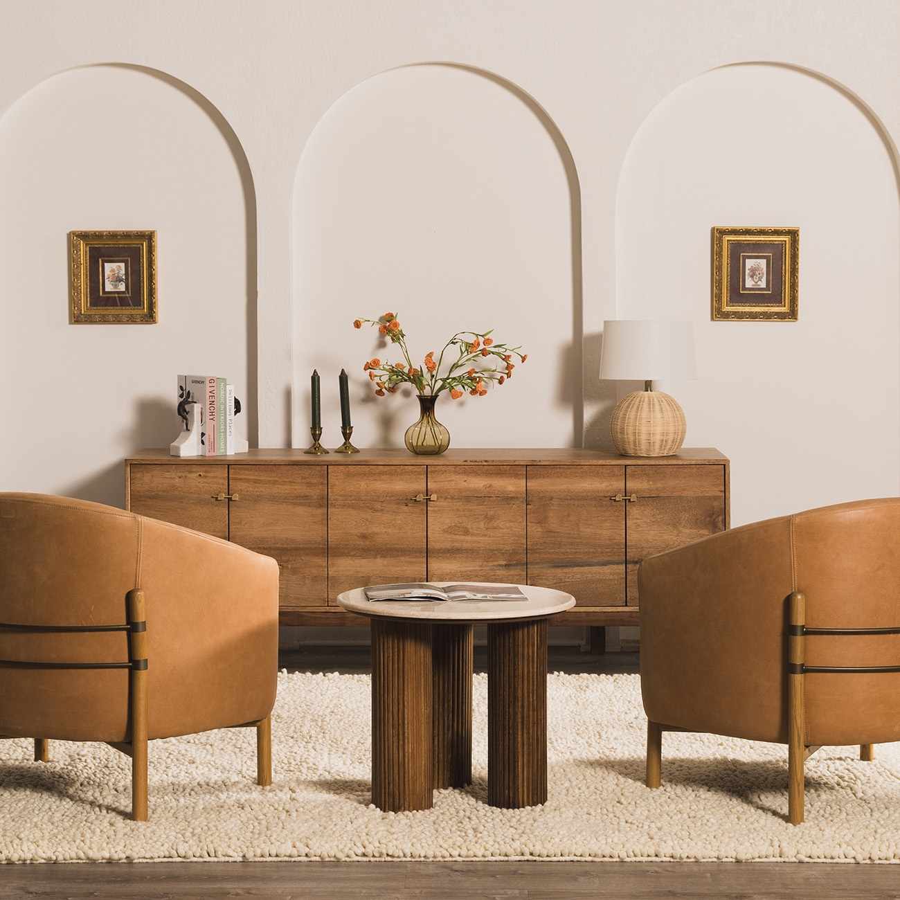 Living room scene with a cream Oakridge Area Rug, tan leather chairs, and a wood cabinet. Roomscene-Rectangle
