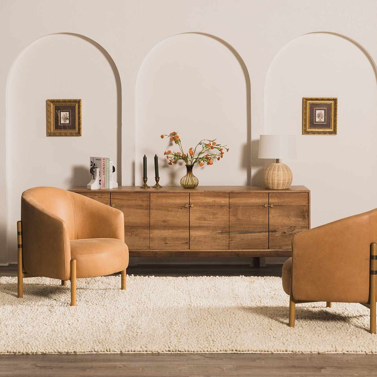 Living room scene with cream Oakridge Area Rug, leather chairs, and wooden sideboard. Roomscene-Rectangle