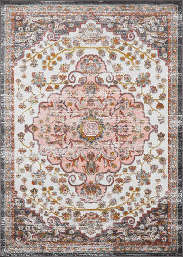 Close-up of the Oark Floral Medallion Area Rug. Features a pink floral medallion on off-white with red, blue, and mustard accents. Design-Rectangle-679