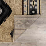 Close-up of Buckhaven Brown Aztec Carpet showing the geometric pattern, colors, and backing. Fold