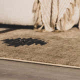 Close-up of the Buckhaven Brown Aztec Carpet showing the texture and pattern details. Tan, black, and brown colors. Styleshot