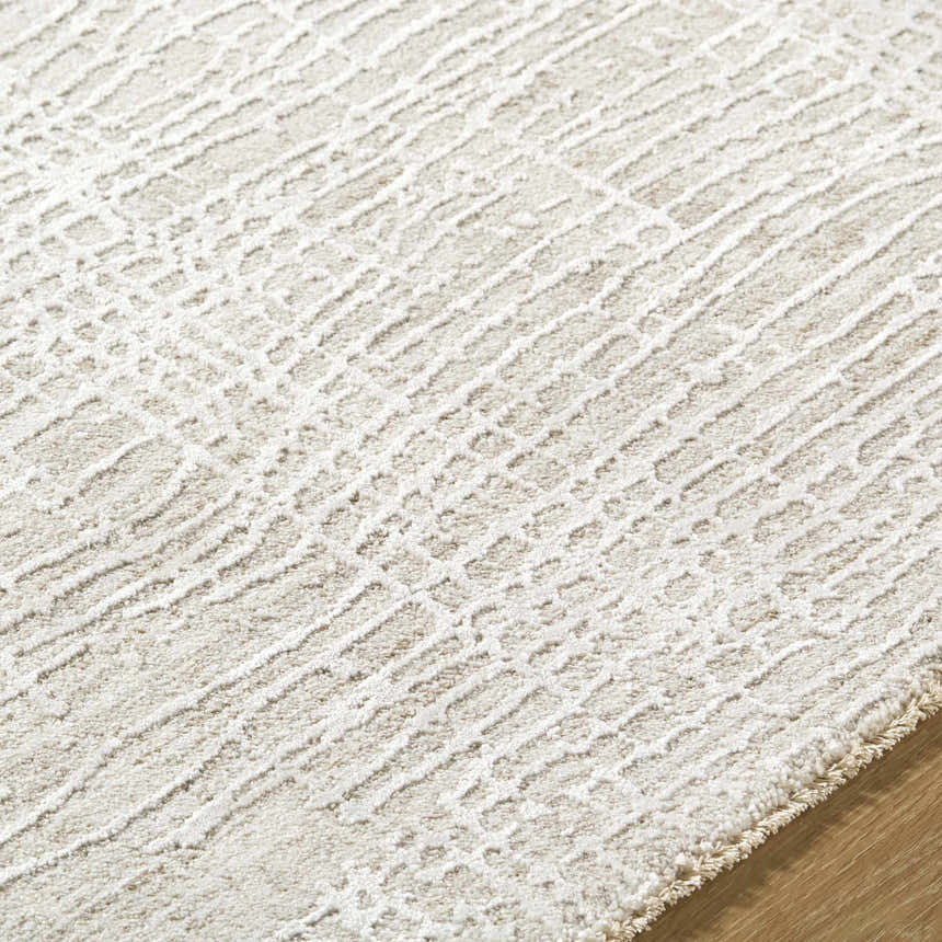 Close-up of the Axelia Charcoal Area Rug showing its cream and charcoal Southwestern-inspired geometric pattern. Texture