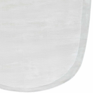 Close-up of the ivory white Anjang Modern Faux Silk Rug, showing its subtle striped pattern and soft viscose texture. Corner