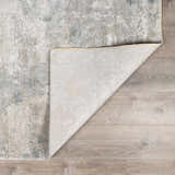 Close-up of the Pialba Thick Luxe Abstract Smokey Rug showing its dusty sage, blue, and gray abstract pattern and texture. Fold